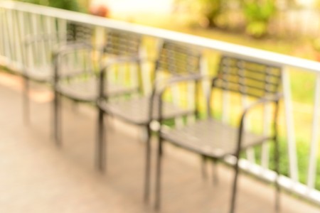 blur row silver color metal chairs on balconyの写真素材