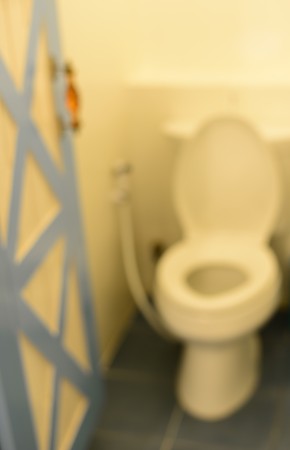blur opened door to white seat toiletの写真素材
