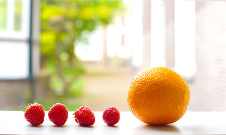 orange and strawberry fruit in natural soft backgroundの写真素材