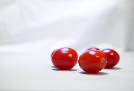 red tomato on white background