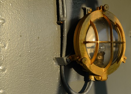 vintage grunge metal lamp on grey ship textureの写真素材