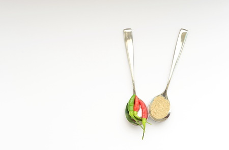 chili and sugar in spoon