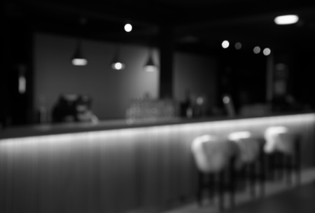 blur three chair at counter of restaurant in black and white abstractの写真素材