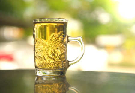relax tea drink in clear glass with nature backgroundの写真素材