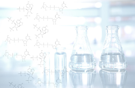 light on chemical structure with flask and vial background in science laboratoryの写真素材