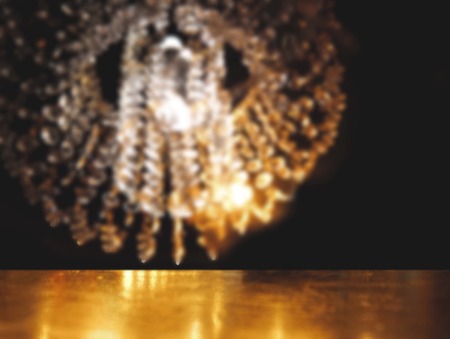 top of table brown wood with blur elegant light lamp in the dark nightの写真素材