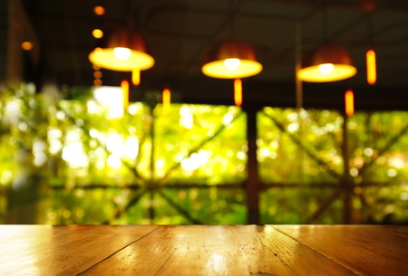 three lamp in pub or bar in the dark green light with wood table backgroundの写真素材