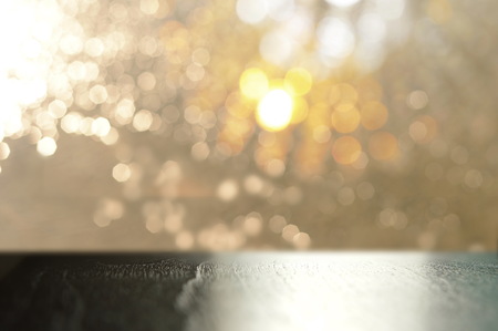 top of black wood table with gold silver bokeh light background in bar or pubの写真素材