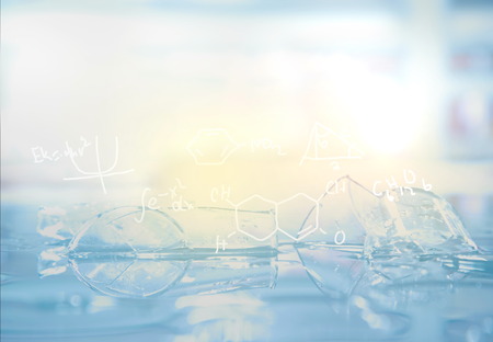 blue light broken glassware in laboratory and science chemical strcuture formular backgroundの写真素材