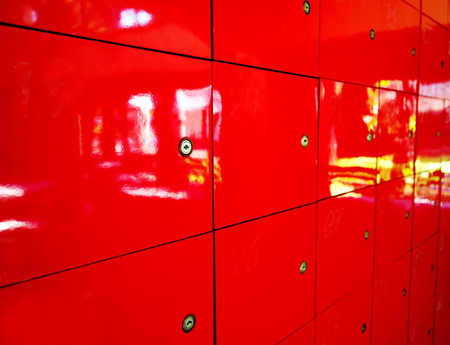 patern of mail post box red locker design with key backgroundの写真素材