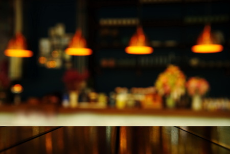 top of table with blur light lamp of counter bar or club at night for party or celebrate backgroundの写真素材