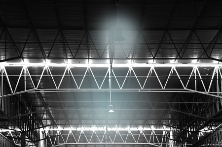 black and white dark light lamp in indoor industrial factory metal iron structure backgroundの写真素材