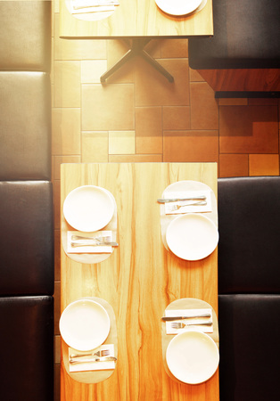 top view of setting diner meal on wood table in restaurant with white dish background