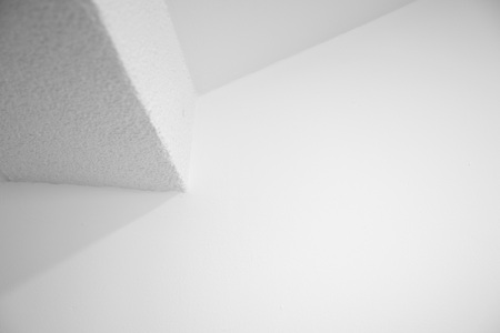light and shadow on corner of ceiling of white minimalism style of home interior architecture backgroundの写真素材