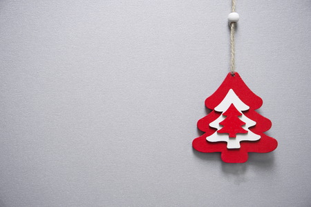 decoration red and white craft of wooden pine tree for Christmas celebration holiday with gray...