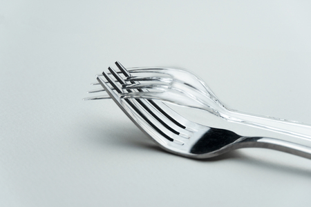 clear plastic and metal fork for food and restaurant in environmental zero waste concept backgroundの写真素材