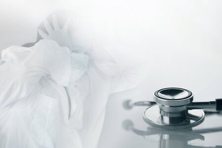 metal stethoscope for medical health check up with panic doctor in corona virus pandemic concept backgrpundの写真素材