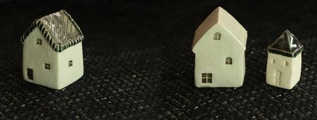 small ceramic model house for real estate or insurance business banner background