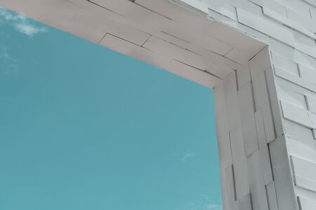 abstract modern white frame door  or window brick building green blue sky architecture backgroundの写真素材