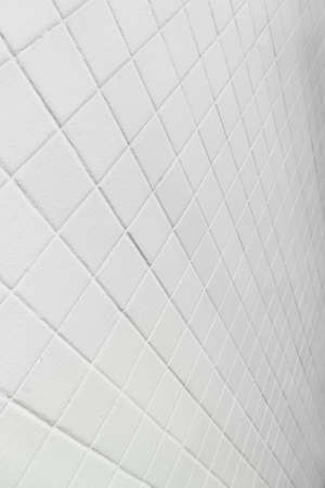 modern line of white rectangular tile wall architecture backgroundの写真素材