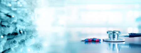 stethoscope for doctor diagnosis with capsule drug with molecular chemistry structure in blue health science laboratory banner backgroundの写真素材