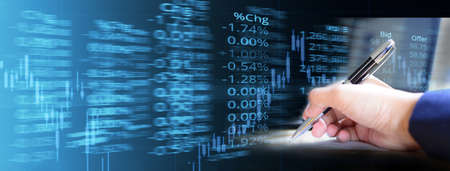 business woman hand with pen and candle stick graph line of trade market stock and price index...