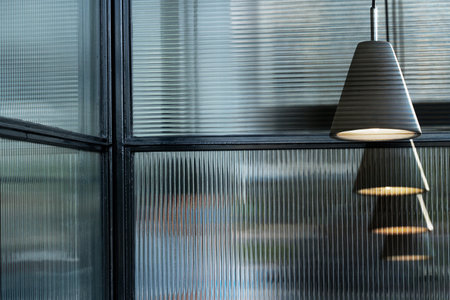 row of grey lamp light in glass room architecture interior backgroundの写真素材