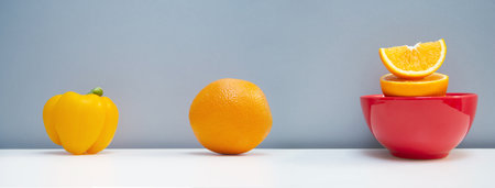 raw orange chili and fruit with red cup organic refreshment food banner backgroundの写真素材