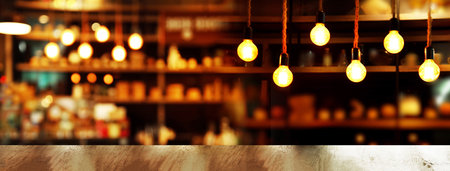 top of wood table with lamp light of bar cafe or pub in dark night party banner backgroundの写真素材