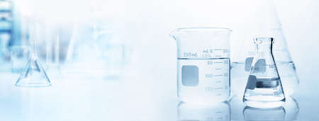 flask with clear beaker and glassware in medical science lab banner white backgroundの写真素材