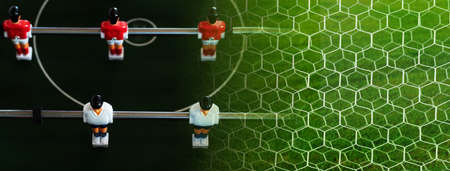 dark green sport football or soccer game toy for recreation time and white net goal with natural...