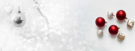 silver and glowing ball and gift  box Christmas ornament for festive decoration on luxury glitter white bokeh banner backgroundの写真素材