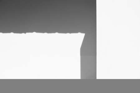 shadow and light on cement white wall part of architecture backgroundの写真素材