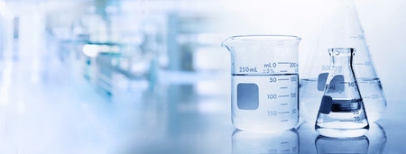 beaker and flask with water  in chemistry science lab banner backgroundの写真素材