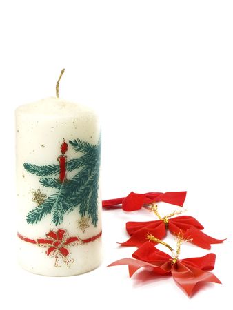christmas candle and ribbon isolated on white backgroundの写真素材
