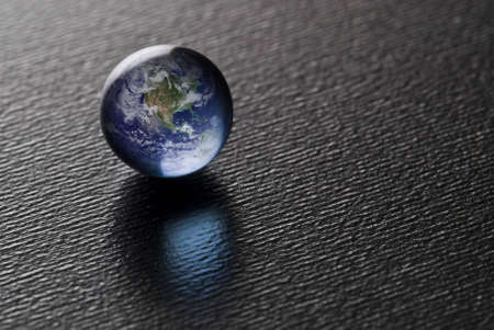 A Blue Pearl on black (Credit for the Blue Marble goes to NASA) Image found at http://visibleearth.nasa.gov/の写真素材