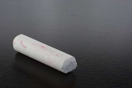 A white Chalk on a black board.の写真素材