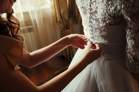 Beautiful bride close up in white dress. Dress with laceの写真素材
