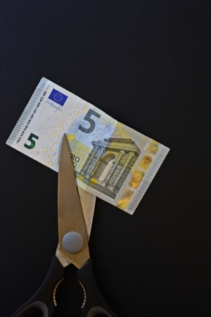 Cut money in halfeの写真素材