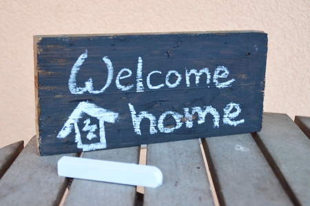welcome home writen on a chalk boardの写真素材