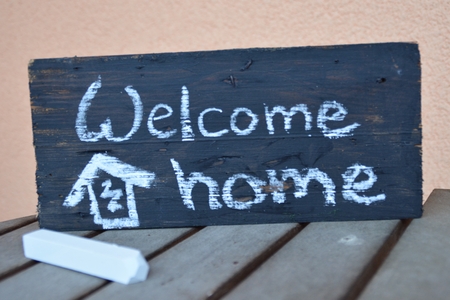 welcome home writen on a chalk boardの写真素材