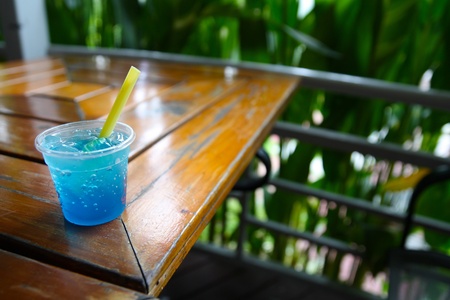 blue soda beverage in tiny glass on  tableの写真素材