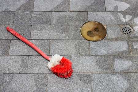 Concept image for sanitary to show by brush, hole and wet floor in bathroomの写真素材
