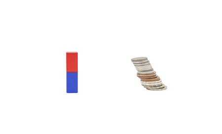 Power of attraction to money, concept image to show by magnet and coin