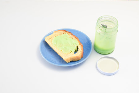Coating bread with pandan custard to made it sweet and delicious.の写真素材