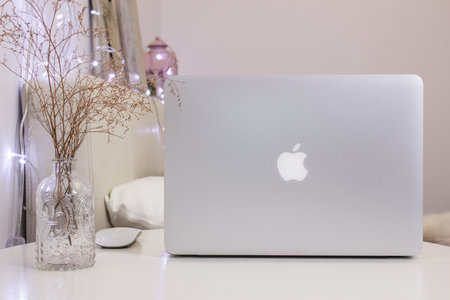 1 of January, Moscow. Cozy room workplace with Macbook Pro, Mockup. Trendy feminine desktop, blog social post photographyのeditorial素材