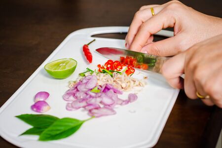 top view of  onions, chilies,lemon, To make tom yum on a wooden floor