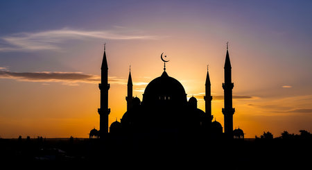 Silhouette of mosque at sunset. Ramadan Kareem background.の素材