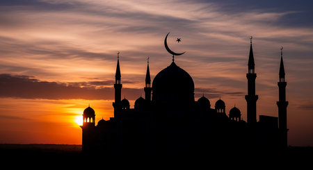 Silhouette of mosque at sunset. Ramadan Kareem background.の素材