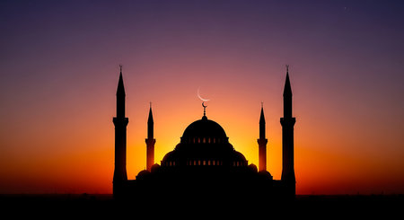 Silhouette of mosque at sunset. Ramadan Kareem background.の素材